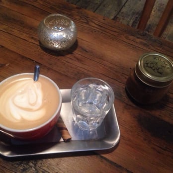 Pot Kettle Black - The most delicious lattes I've had in a while on a cool tray with water and a biscuit! - Coffee & Tea Near Me - Manchester, XGM