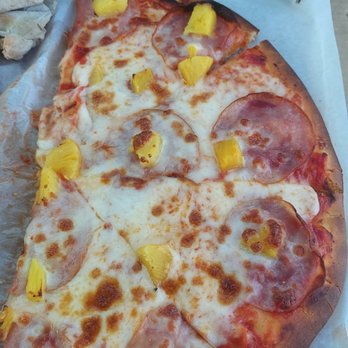 Brass Lamp Bistro - a pizza with pineapple toppings - Pizza Near Me - Huntsville, Utah