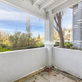 Geneva Pointe - Covered patio corner overlooking grassy common area - Apartments Near Me - Elk Grove, California Geneva Pointe - Covered patio corner overlooking grassy common area - Apartments Near Me - Elk Grove, California