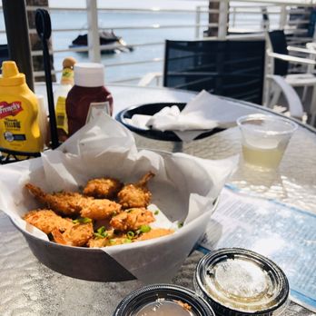 Kokomos Bar & Grille - Coconut shrimp and white wine - Bars Near Me - Clearwater Beach, Florida Kokomos Bar & Grille - Coconut shrimp and white wine - Bars Near Me - Clearwater Beach, Florida