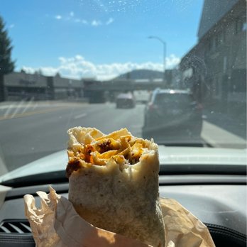Burrito Sunrise - a burrito sitting in a wrapper on the dashboard of a car - Mexican Near Me - Bend, Oregon Burrito Sunrise - a burrito sitting in a wrapper on the dashboard of a car - Mexican Near Me - Bend, Oregon