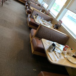 The place was empty, but the leftover food was left at lots of tables