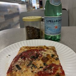 Luigis Pizza - My grandmothers slice and she upleveled me with pellegrino