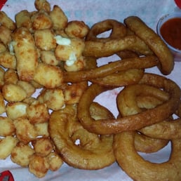Combo appetizer with onion rings and cheese curds Combo appetizer with onion rings and cheese curds