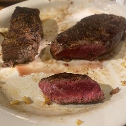 First overcooked strip of meat to the left. On the right was the severely undercooked replacement.