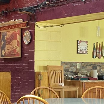 Stringtown Bar & Grill - a table and chairs - American Near Me - Florence, Kentucky Stringtown Bar & Grill - a table and chairs - American Near Me - Florence, Kentucky