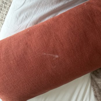 Hotel Dega - Stained decorative pillow on bed - Hotels Near Me - Bodega Bay, California Hotel Dega - Stained decorative pillow on bed - Hotels Near Me - Bodega Bay, California