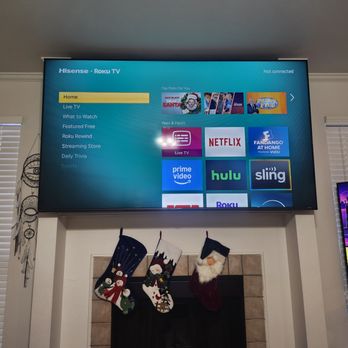 Xtreme Mounting - 85 inch tv hung above a fireplace with full motion mount - Handyman Near Me