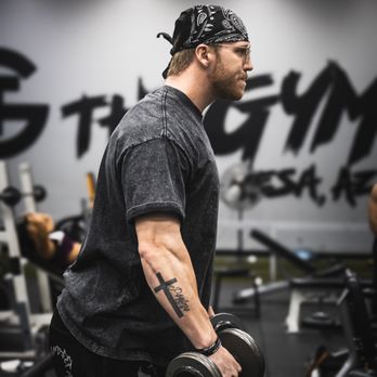 TG The Gym Mesa - TG Member preforming dumbell lateral raises - Trainers Near Me - Mesa, Arizona TG The Gym Mesa - TG Member preforming dumbell lateral raises - Trainers Near Me - Mesa, Arizona