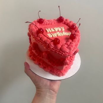 Sister Slice - a hand holding a birthday cake - Custom Cakes Near Me - Salt Lake City, Utah Sister Slice - a hand holding a birthday cake - Custom Cakes Near Me - Salt Lake City, Utah