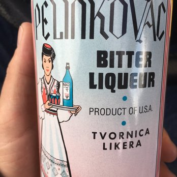 Woodland Liquors - a hand holding a bottle of bitter liquor - Beer, Wine & Spirits Near Me - Duluth, Minnesota Woodland Liquors - a hand holding a bottle of bitter liquor - Beer, Wine & Spirits Near Me - Duluth, Minnesota
