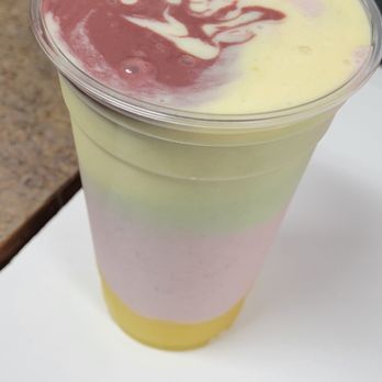 Black Diamond Cafe - a pink, yellow, and white dessert in a plastic cup - Juice Bars & Smoothies Near Me - Springfield, Oregon