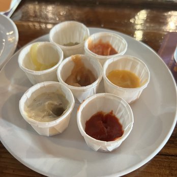 The Forum - Plate of sauces (some have been dipped in to) - Pubs Near Me - Puyallup, Washington