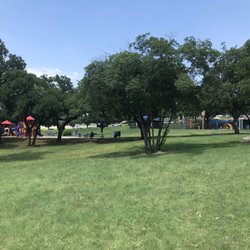 View from parking lot: Playground on left, splash pad on right