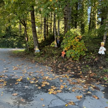 Old World Gingerbread Village - a teddy bear in the middle of the road - Desserts Near Me - Mapleton, Oregon