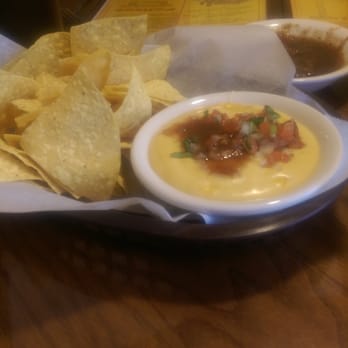 Señor Taco - Chips and queso. Nice and thick cheese and fresh pico de gallo on top. For $4.50 it's a must have! - Mexican Near Me - Pinellas Park, Florida