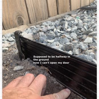 The Grounds Guys - a photo of a person's hand touching a rail - Lawn Services Near Me The Grounds Guys - a photo of a person's hand touching a rail - Lawn Services Near Me