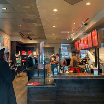 Starbucks - a woman standing in a coffee shop - Coffee & Tea Near Me - Rockville, Maryland Starbucks - a woman standing in a coffee shop - Coffee & Tea Near Me - Rockville, Maryland