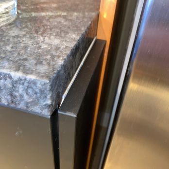 Precision Countertops - New counter does not cover cabinet end panel. - Countertop Installation Near Me - Kent, Washington