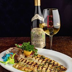 Seafood excellence at Empire Steak House West: Grilled Branzino.
