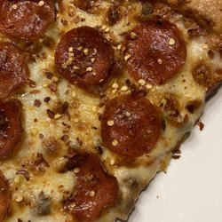 King's Famous Pizza - Pepperoni and Sausage Slices. Gotta have the reps pepper flakes.
