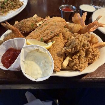 Pappadeaux Seafood Kitchen - Fried platter of catfish, oysters, shrimp, stuffed shrimp, stuffed crab with French fries. Along with salad. - Seafood Near Me - San Antonio, Texas