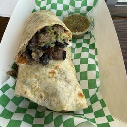 Carne asada burrito with green chili salsa