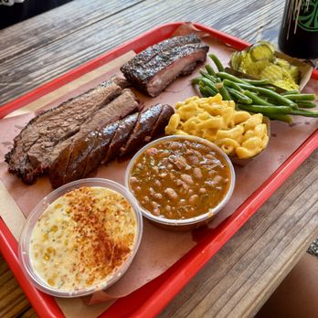 Terry Black's Barbecue - brisket, sausage, pork rib, creamed corn, pinto beans, green beans, mac & cheese, pickles - Barbeque Near Me - Austin, Texas Terry Black's Barbecue - brisket, sausage, pork rib, creamed corn, pinto beans, green beans, mac & cheese, pickles - Barbeque Near Me - Austin, Texas