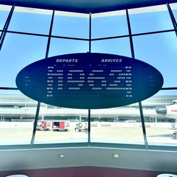 TWA Hotel - TWA Hotel Lobby lounge sign continually changes its fun messaging - Hotels Near Me - New York, New York