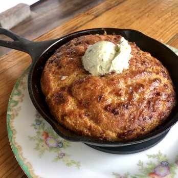 Odd Duck - Cast iron cheddar cornbread, spring onion cultured butter - American Near Me - Austin, Texas Odd Duck - Cast iron cheddar cornbread, spring onion cultured butter - American Near Me - Austin, Texas