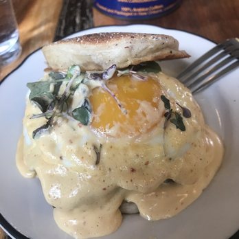 Milktooth - lamb merguez, house made english muffin, harissa hollandaise, caramelized onions and apples - Breakfast & Brunch Near Me - Indianapolis, Indiana