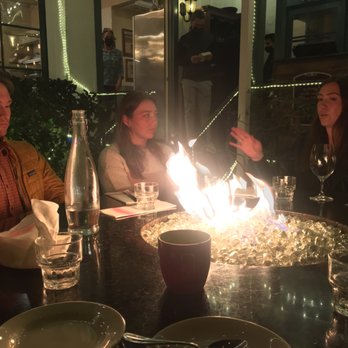 Zaytoon - Family around cozy flame. Kitchen in background. - Lebanese Near Me - Santa Barbara, California Zaytoon - Family around cozy flame. Kitchen in background. - Lebanese Near Me - Santa Barbara, California
