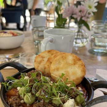 Flora - Shakshouka , eggs , plant chorizo, tomato, peppers, cilantro, avocado, queso fresco, colombian arepas. Huevitos en purgatorio ! - Breakfast & Brunch Near Me - Miami, Florida Flora - Shakshouka , eggs , plant chorizo, tomato, peppers, cilantro, avocado, queso fresco, colombian arepas. Huevitos en purgatorio ! - Breakfast & Brunch Near Me - Miami, Florida