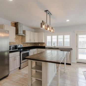 Modish Designs - a kitchen with stainless steel appliances - Flooring Near Me - Haltom City, Texas Modish Designs - a kitchen with stainless steel appliances - Flooring Near Me - Haltom City, Texas