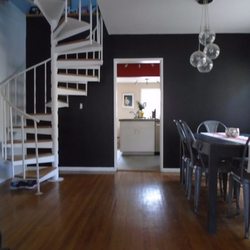 Sherwin-Williams Paint Store - Tricorn black accent wall, ice cube white on surrounding walls.