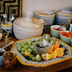 Hotel Guldsmeden - Beautiful breakfast buffet with breads, pastries, fruit, oats, meats, smoked salmon, yogurt, jams and spreads, and organic juices