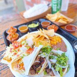 Holé Molé - Surf & Turf Taco Plate....2 Baja fish tacos and 2 smoked beef brisket tacos.....with the fixins