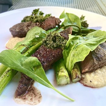 Agate Restaurant - Hanger steak with smoked cheddar grits, broccolini, and chimichurri - Salad Near Me - Bainbridge Island, Washington