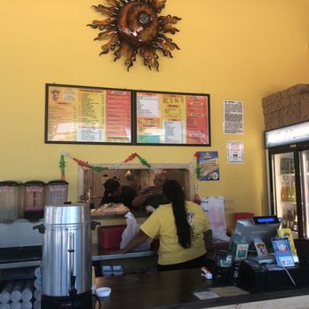 Taco Boy - a woman sitting at a counter - Mexican Near Me - Durango, Colorado Taco Boy - a woman sitting at a counter - Mexican Near Me - Durango, Colorado