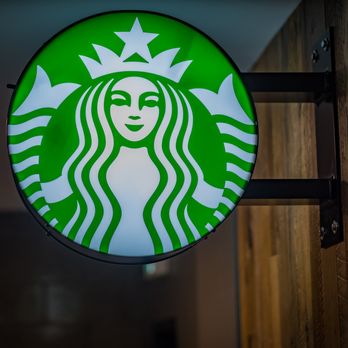 Starbucks - a starbucks sign hanging from the side of a building - Coffee & Tea Near Me - Queenston, Ontario Starbucks - a starbucks sign hanging from the side of a building - Coffee & Tea Near Me - Queenston, Ontario