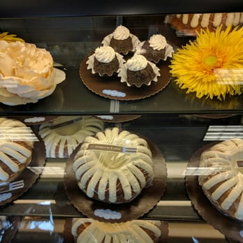 Nothing Bundt Cakes - Bundtinis on top. Full size cakes are under. Bundlet which are smaller and $4 each are on the bottom. - Bakeries Near Me - Miami, Florida Nothing Bundt Cakes - Bundtinis on top. Full size cakes are under. Bundlet which are smaller and $4 each are on the bottom. - Bakeries Near Me - Miami, Florida