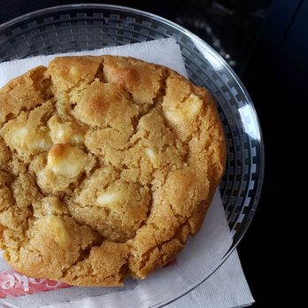 United Airlines - Baked hot at 30,000 feet. White chocolate with macadamia nuts. Hot, crispy on the outside, soft in the middle. - Airlines Near Me - Lihue, Hawaii