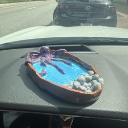 Octopus Ashtray A purple octopus chilling in a little bay with rocks