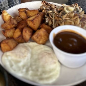 Kihei Caffe Lahaina - Really dry thin pork chops served with incredibly salty gravy. - Breakfast & Brunch Near Me - Lahaina, Hawaii Kihei Caffe Lahaina - Really dry thin pork chops served with incredibly salty gravy. - Breakfast & Brunch Near Me - Lahaina, Hawaii