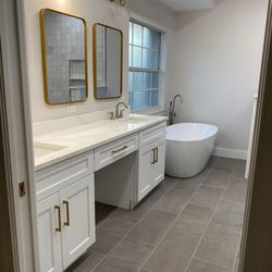 Highland Cabinetry Fort Myers - Classy and clean! White shaker vanities with a knee drawer.