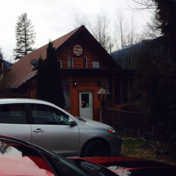 Fomi's  Bakery - wo cars parked in front of a building - Bakeries Near Me