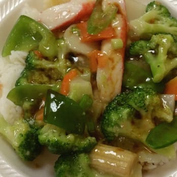 China Wok - A little rice with some of the Seafood Delight and a drizzle of Soy Sauce...  Time to dig in! - Chinese Near Me - Orlando, Florida