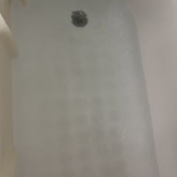 Quality Inn - A clogged tub from a shower.