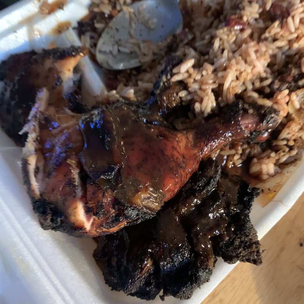 Jerk chicken and rice and peas. Jerk chicken and rice and peas.