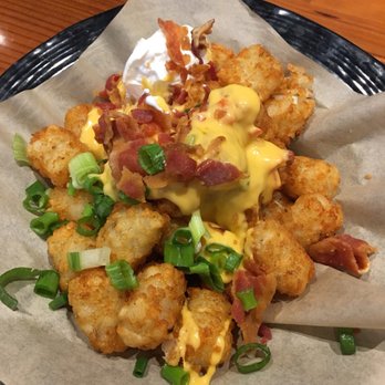 Hooters - 5/5 Lots-a-Tots $6.99 are my fav...ordered 1 to share but then ordered 2 more so we'd have our own... - Sports Bars Near Me - Ocala, Florida
